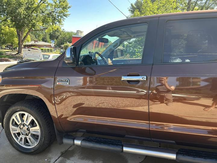 A brown Toyota Tundra from the side