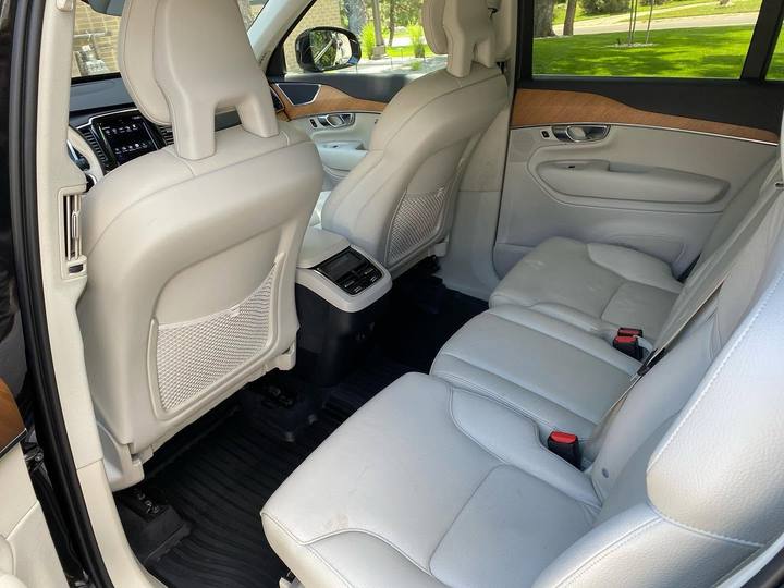 Cream leather rear seats in a Volvo XC90, from the door