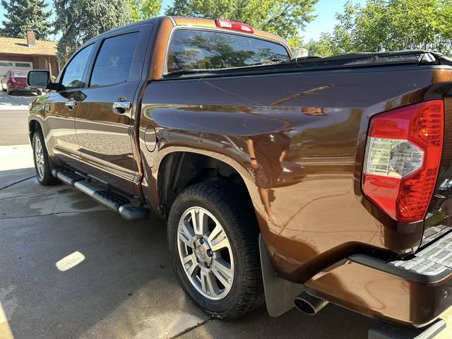 A brown Toyota Tundra, rear three-quarter