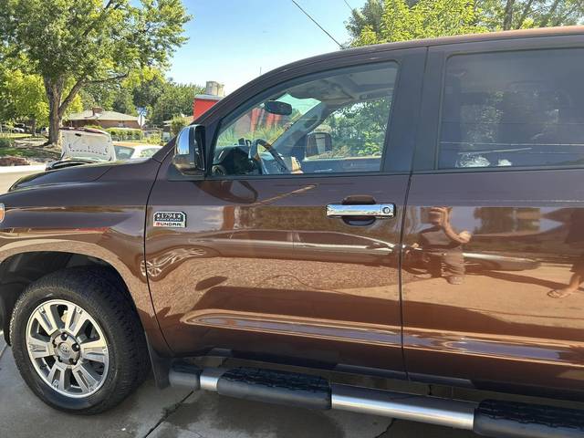 A brown Toyota Tundra from the side