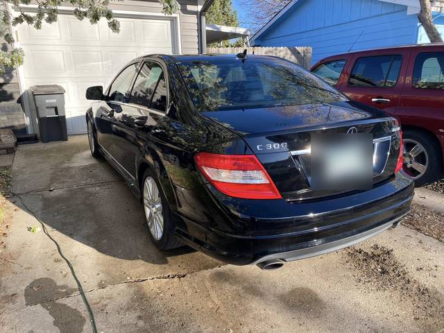 A black Mercedes sedan from the rear