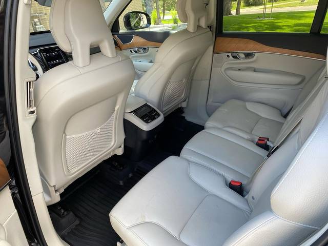 Cream leather rear seats in a Volvo XC90, from the door
